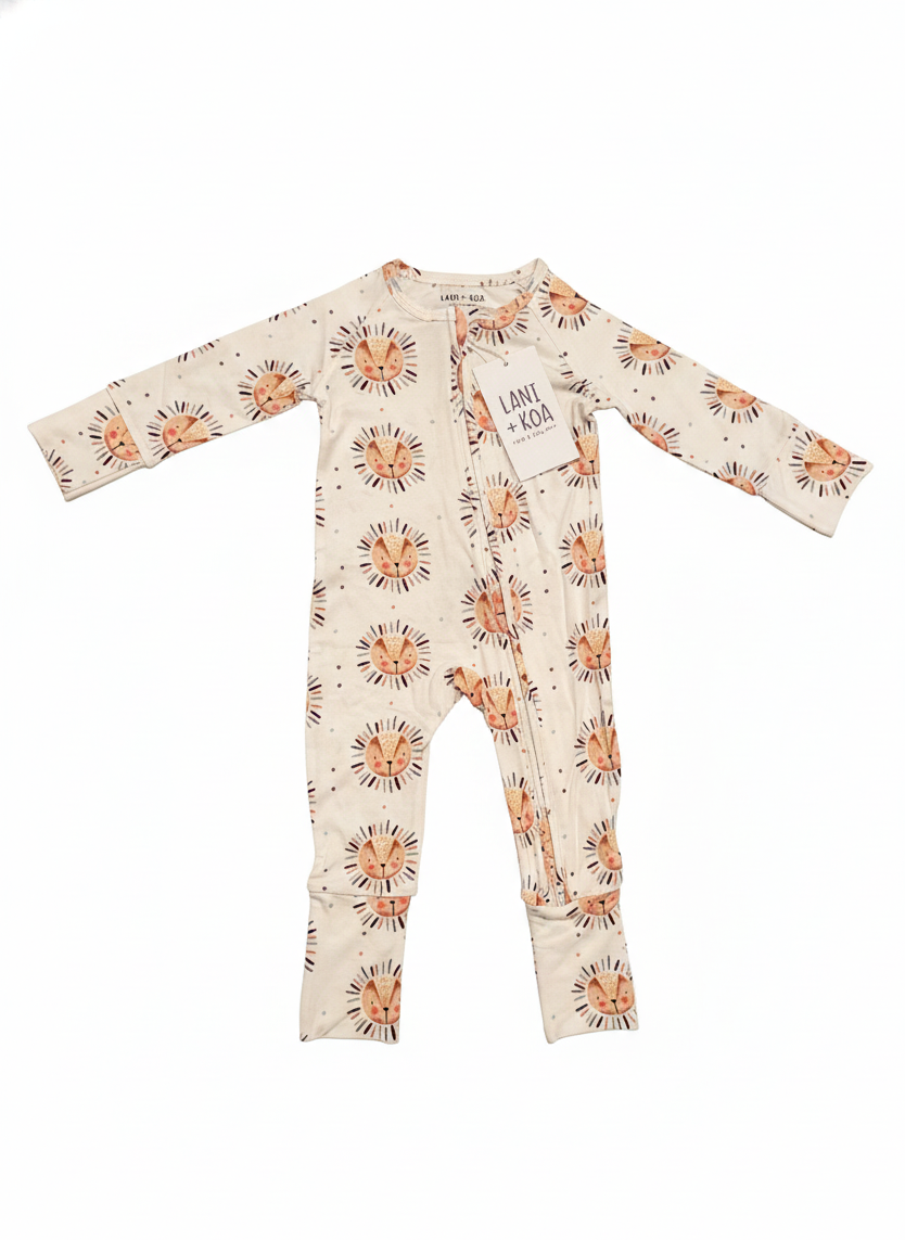 Baby onesie with lion pattern on a white background